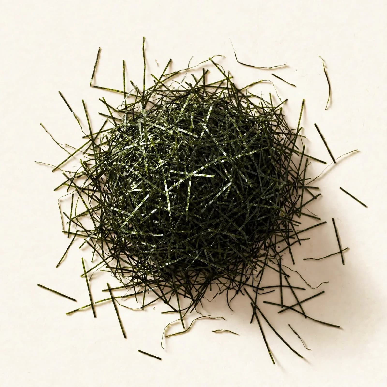 A loose pile of thin shredded nori, seen from above.